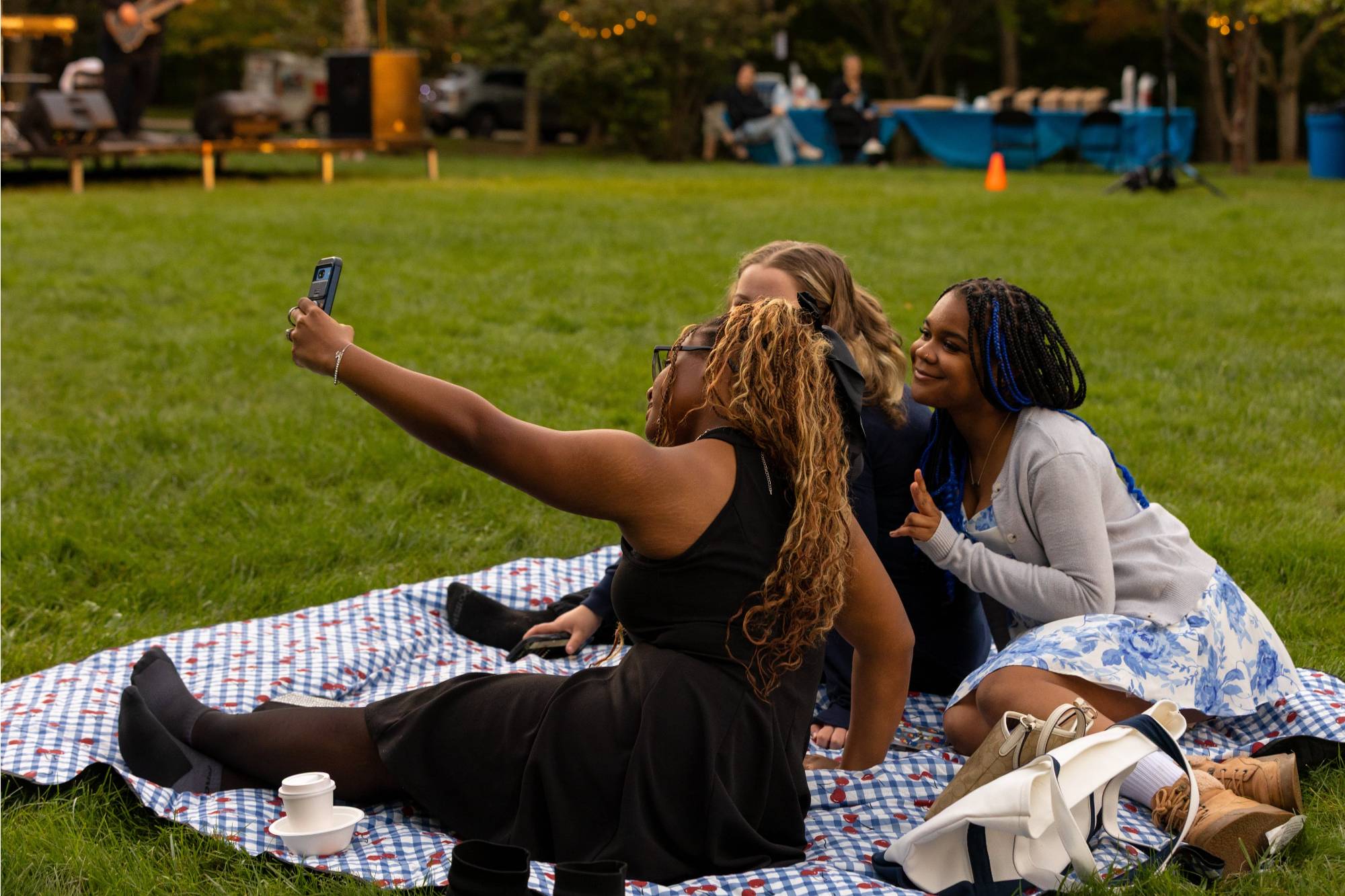 students taking a photo together on blanket
